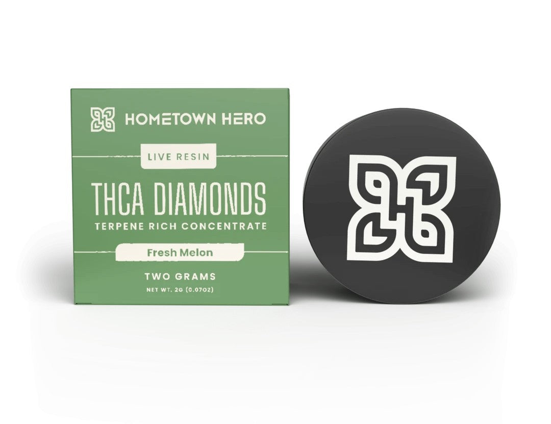 Hometown Hero 2g Fresh Melon sativa hemp live resin THCA diamonds concentrate showing golden crystalline extract in a jar.