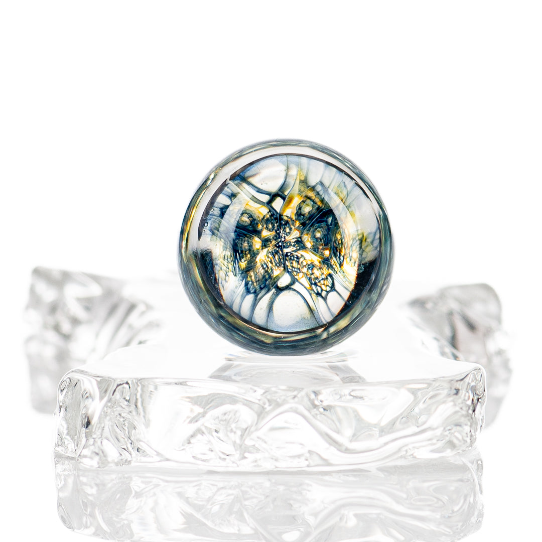 Faceted UV composite marble Indo Glass decorative glass with intricate facets and vibrant colors, showcasing craftsmanship and clarity.