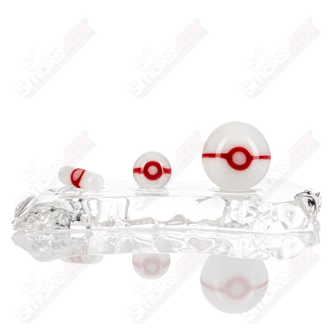 Three-piece Pokeball Terp Slurper Set by Ganja Grimmlin Glass, colorful glass slurper tools with Pokeball design for concentrates.