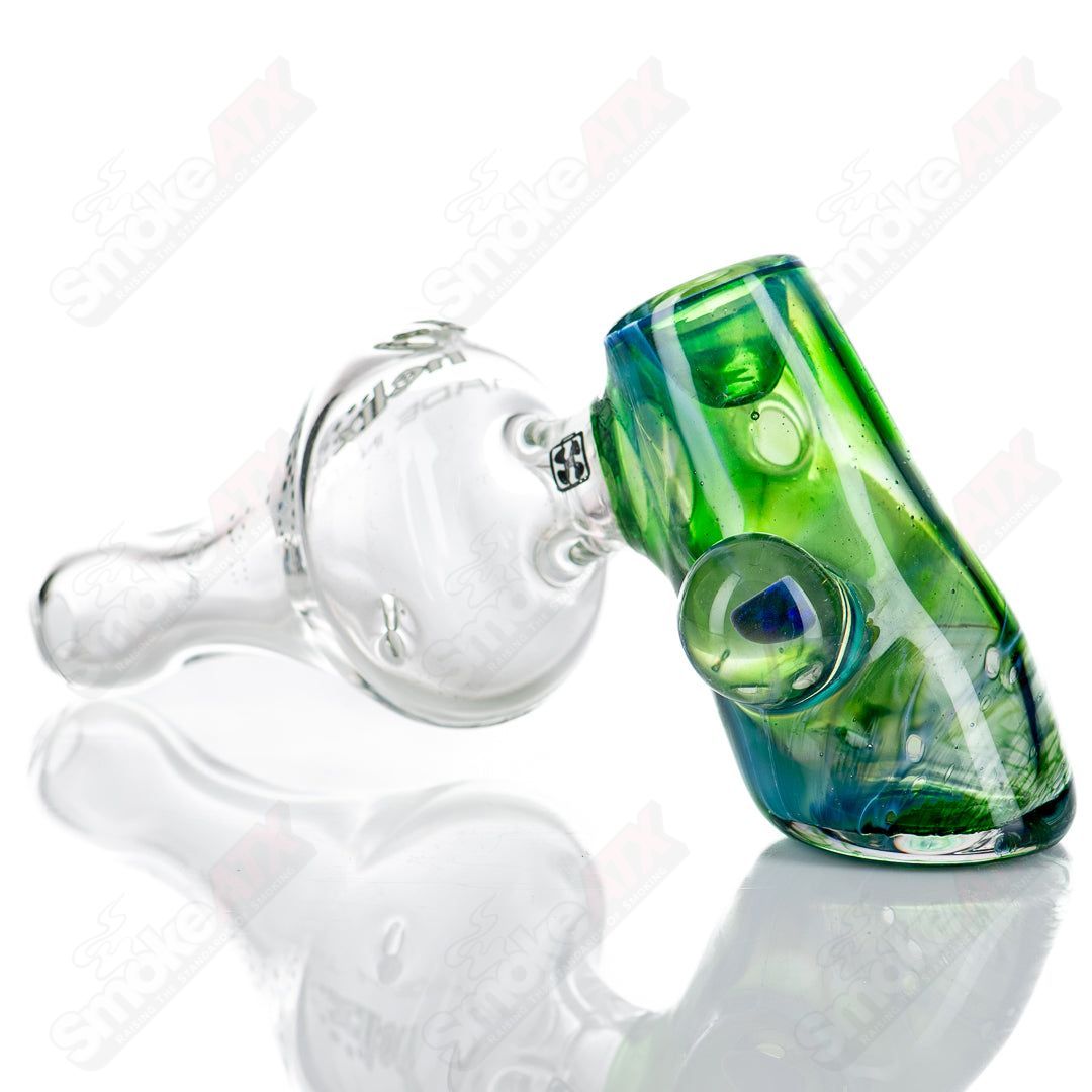 American Helix white glass pipe with a blue-green box fan helix design, featuring a sleek, artistic glass smoking pipe.