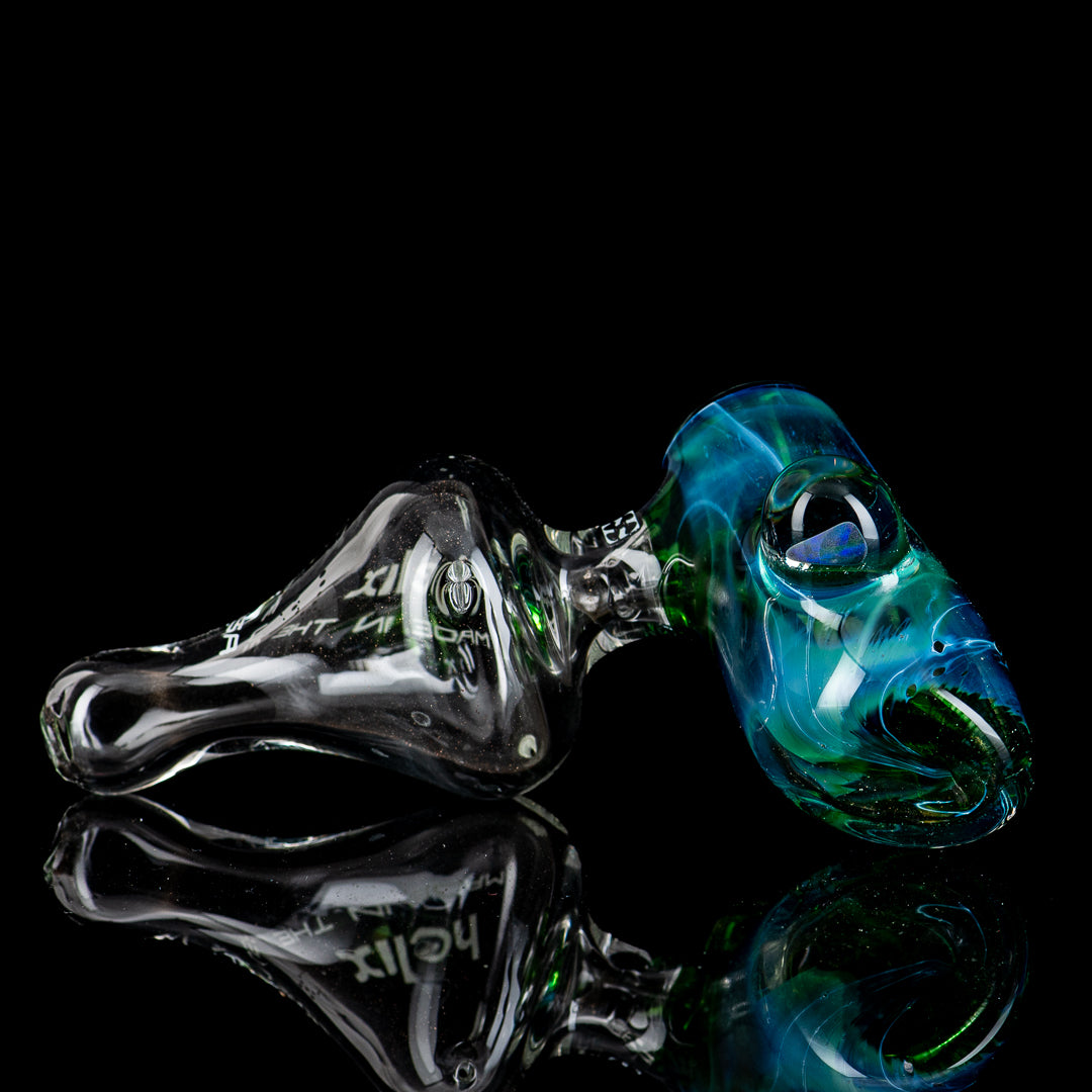 White Label Hammer glass pipe with blue-green box fan helix design by American Helix, featuring clear glass and intricate details.